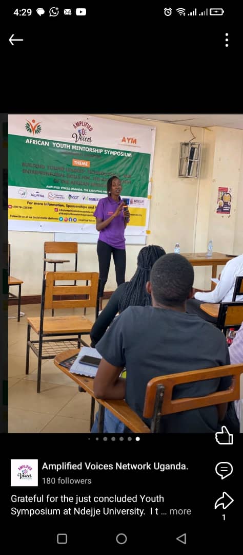 A speaker addressing participants at a youth mentorship symposium.